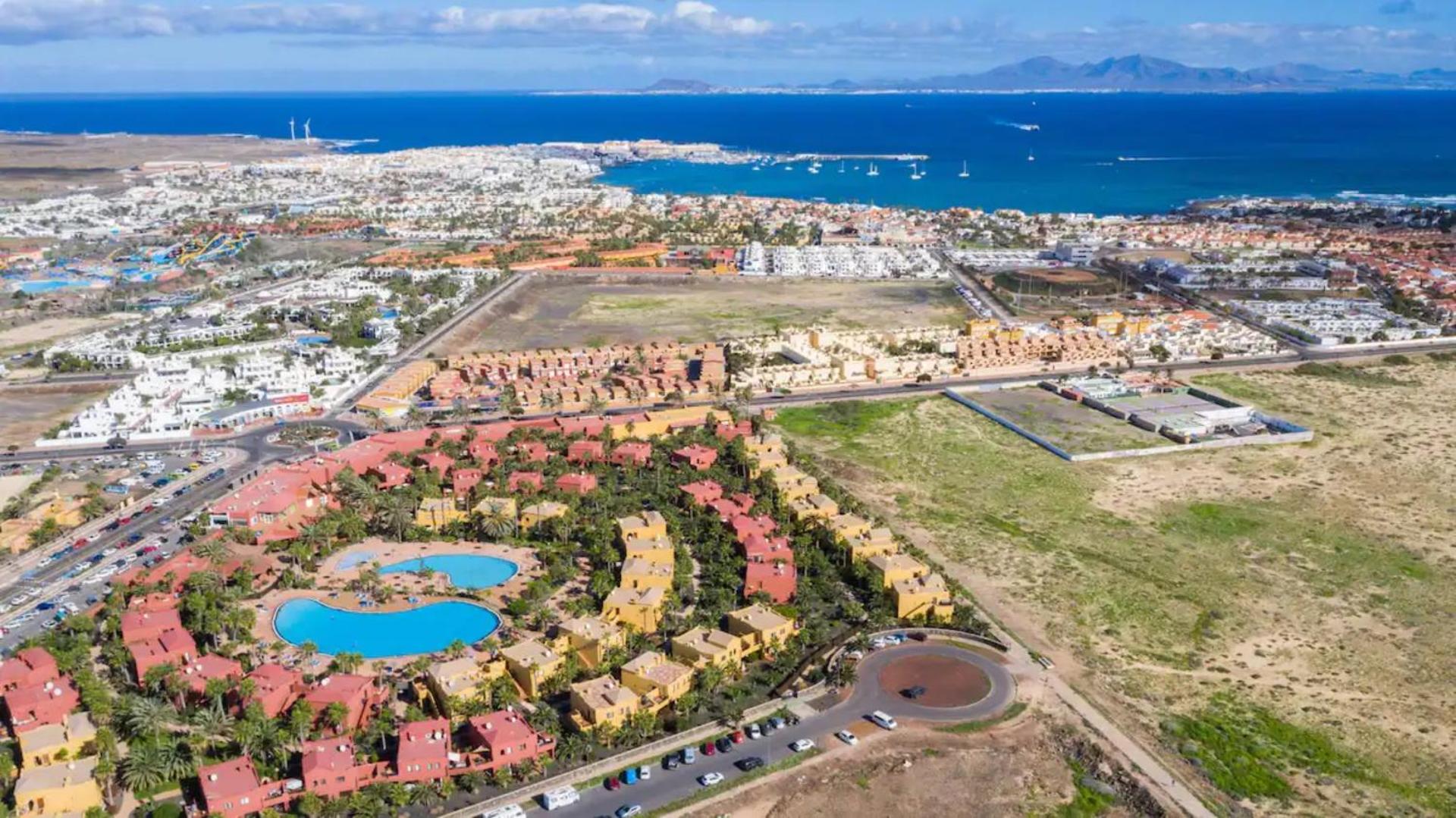 Aerial view of the Oasis Tamarindo resort with the ocean beyond