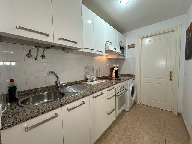 Kitchen worktop, sink and coffee machine