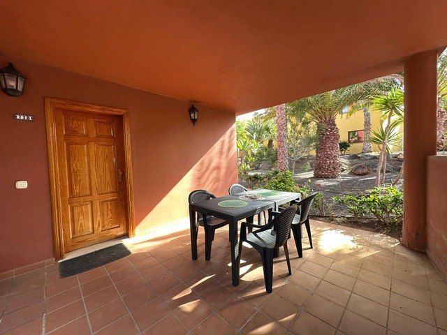 The covered terrace at Oasis Tamarindo with its own front door, table and four chairs