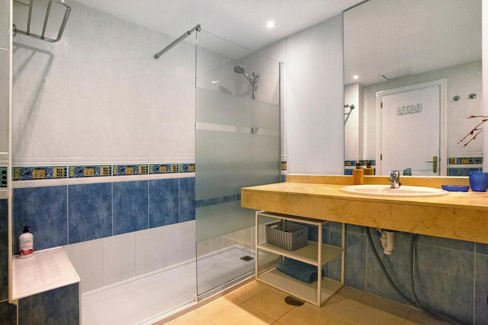 Bathroom with sink and shower