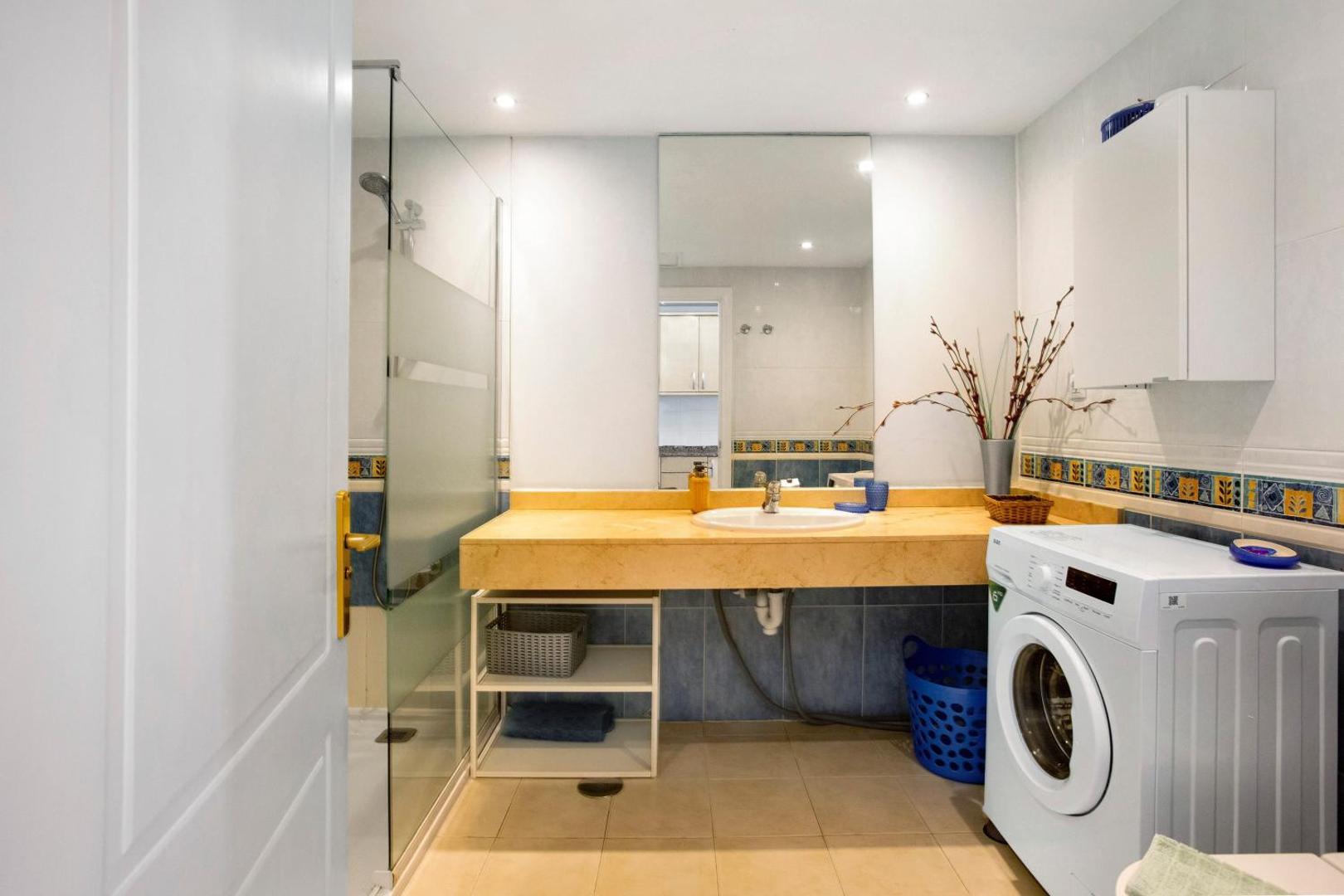 Bathroom with sink and washing machine
