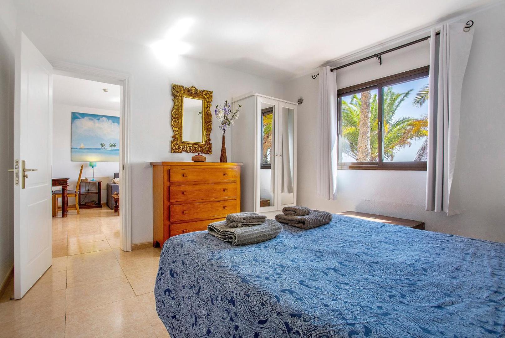 Master bedroom with a double bed and a window
