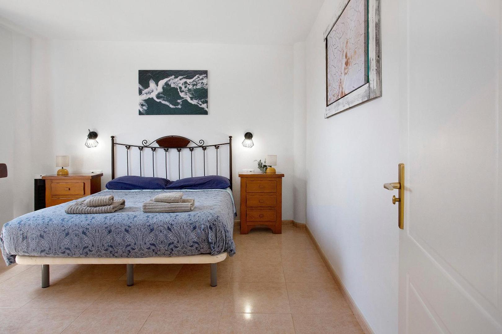 Bedroom with a blue bedspread