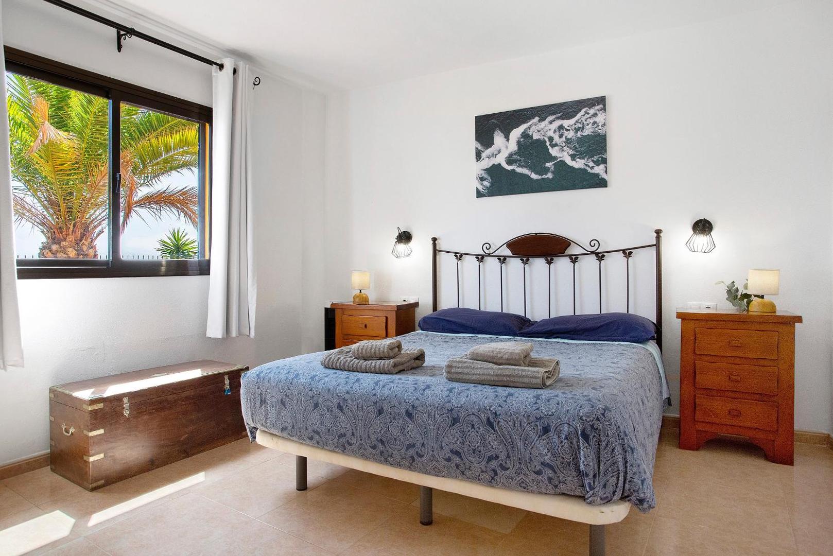 Bedroom with a large window