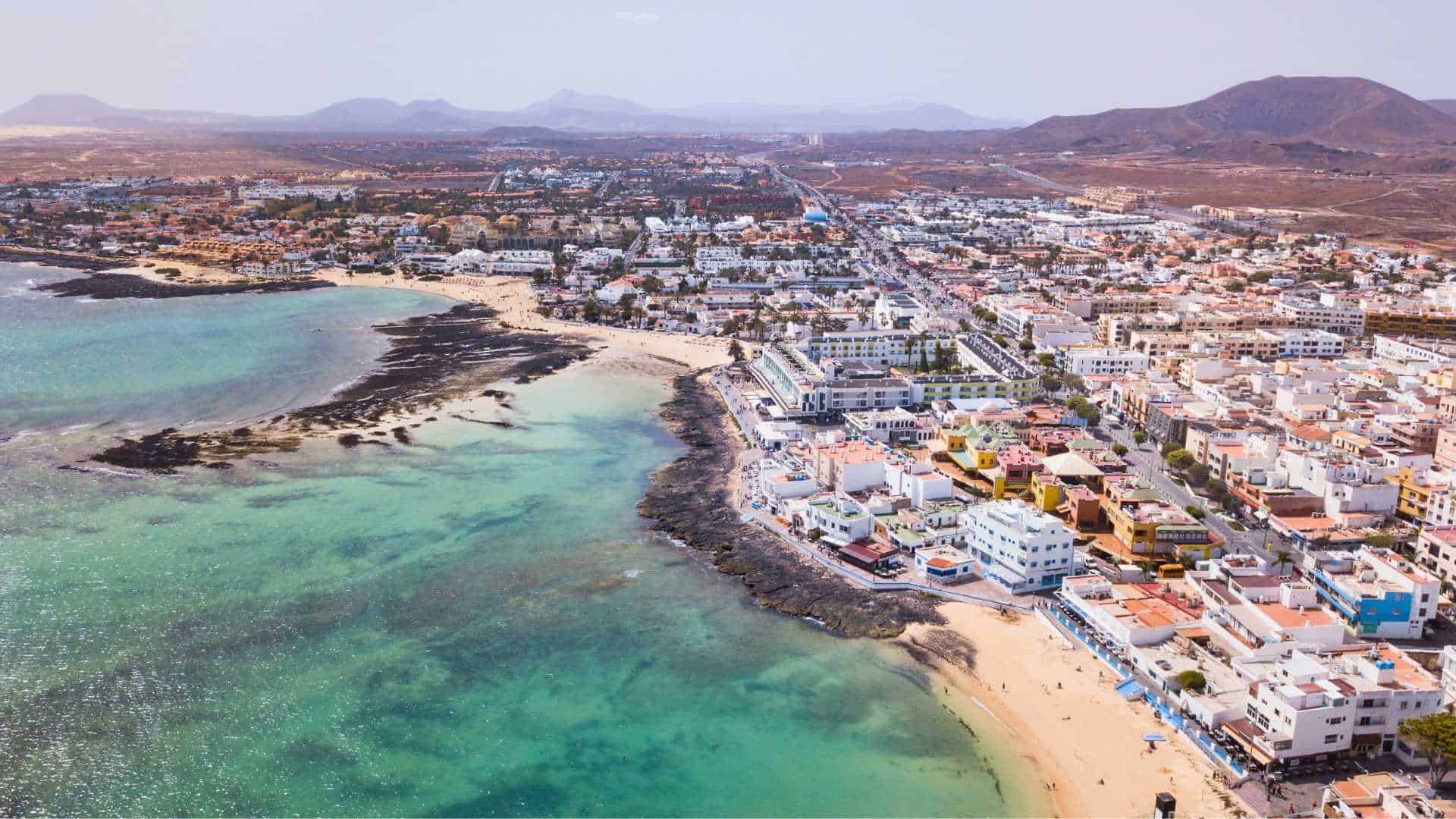 Corralejo from the air, turquoise water along the town shore