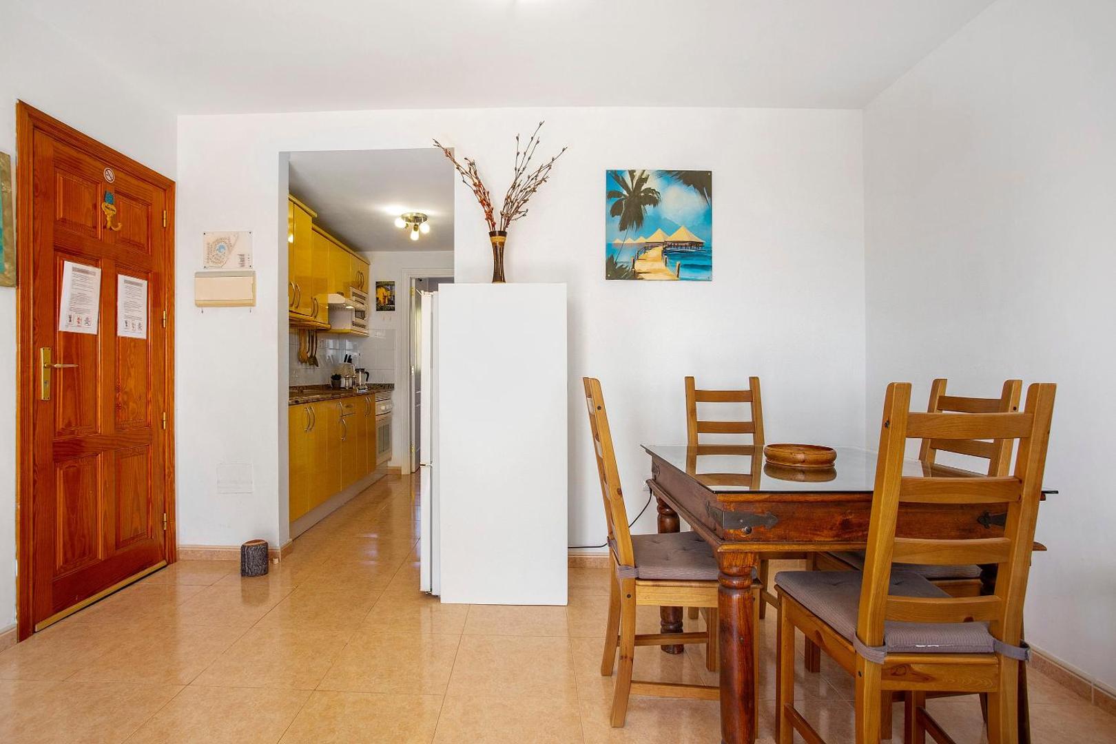 Kitchen and dining area with fridge
