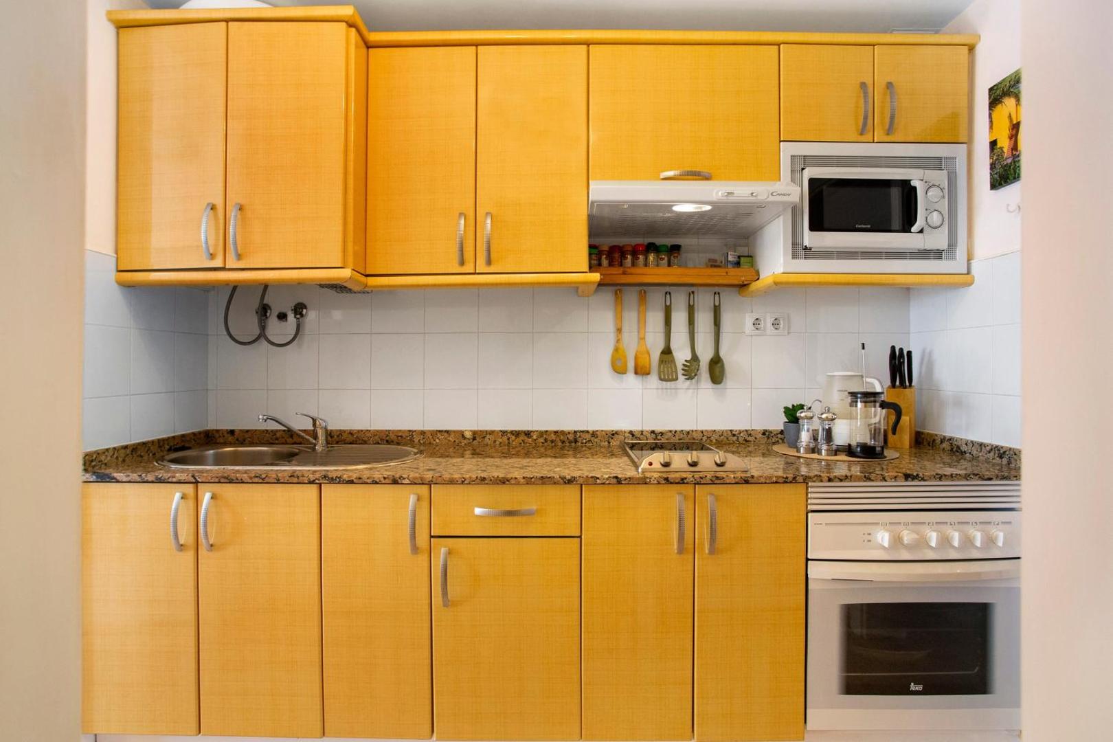 Kitchen cabinets, sink and microwave