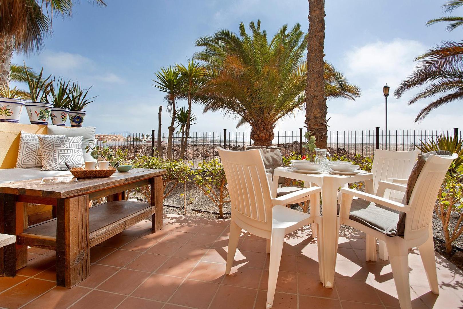 Terrace seating among palm trees