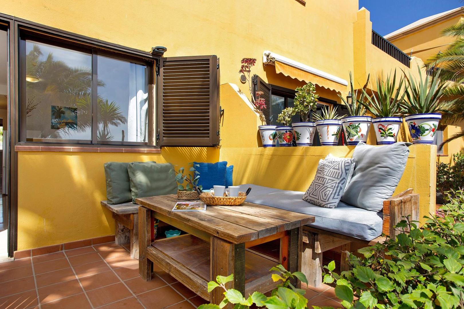 Wooden table and bench on the terrace